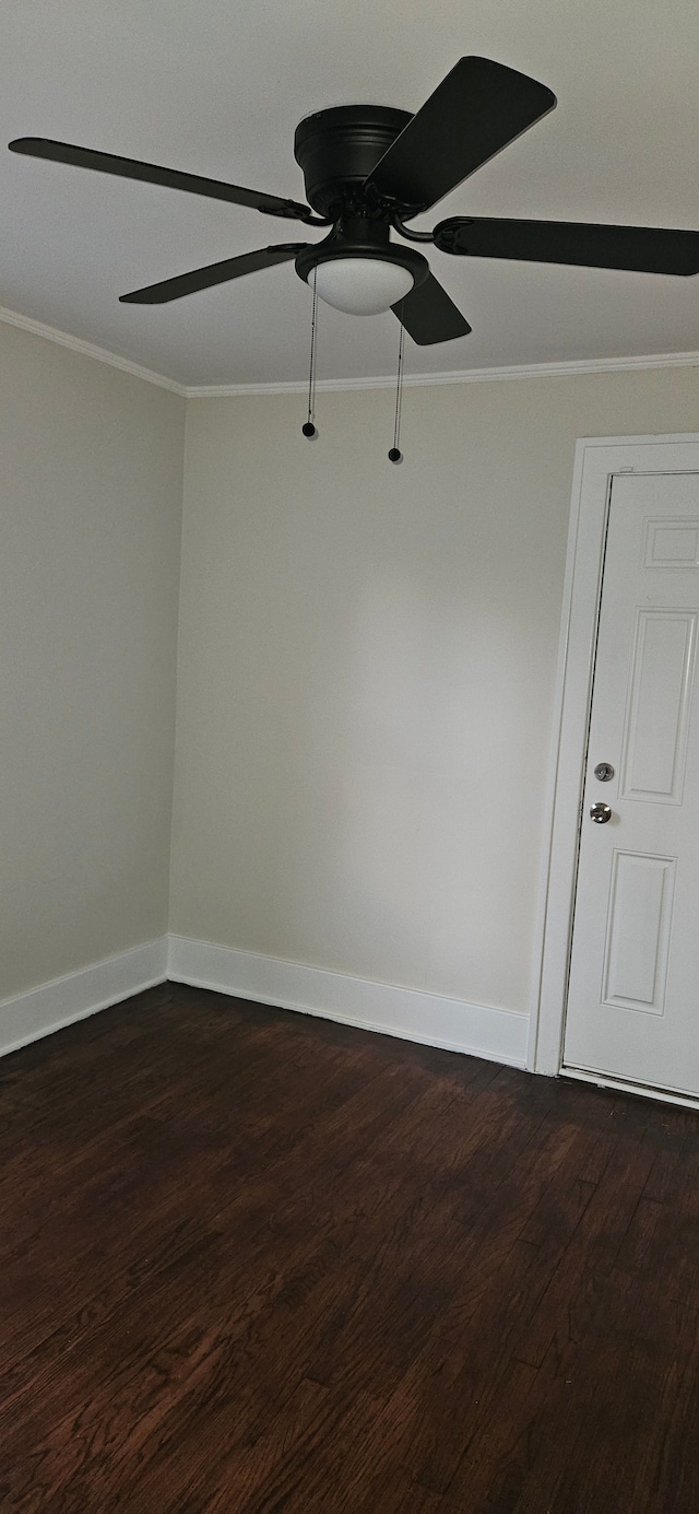 empty room featuring crown molding, hardwood / wood-style floors, and ceiling fan