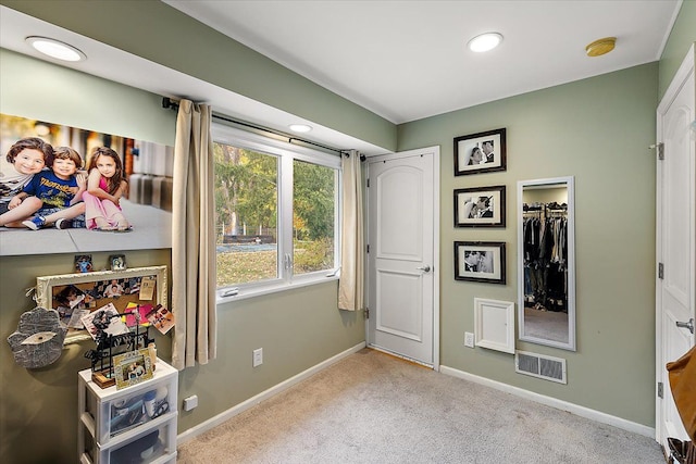 carpeted bedroom featuring recessed lighting, visible vents, and baseboards