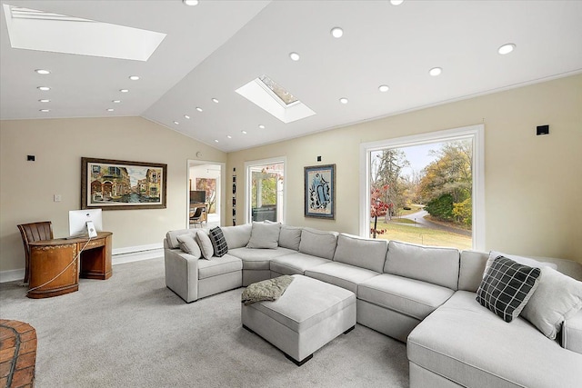 living room with light carpet, vaulted ceiling with skylight, baseboards, and recessed lighting