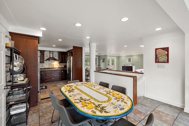 dining space with ornate columns