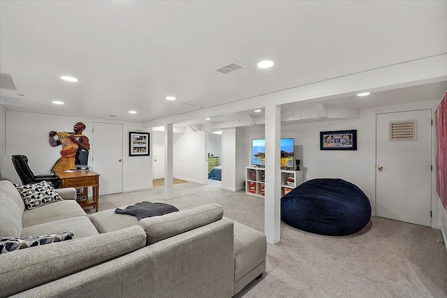 living area with light carpet, visible vents, and recessed lighting