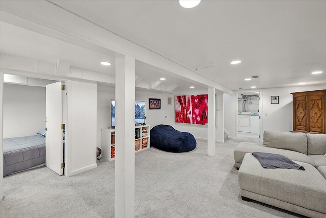 living area featuring recessed lighting, baseboards, carpet flooring, and washing machine and clothes dryer