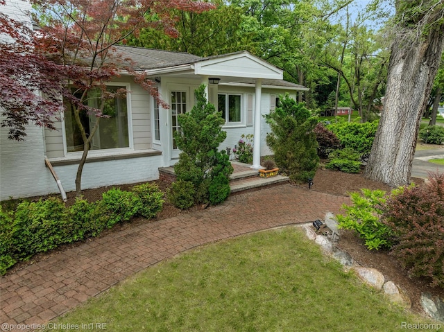 26335 Woodlore Rd, Franklin, MI 48025 - view of front of property with brick siding and a shingled roof