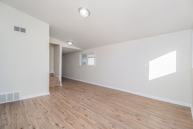 basement featuring light wood-type flooring