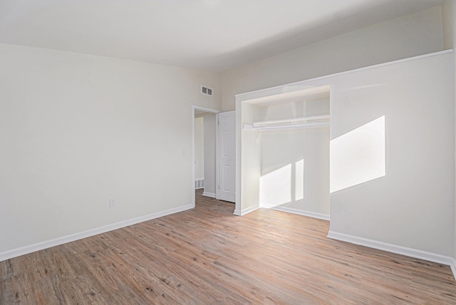 empty room with light wood-type flooring