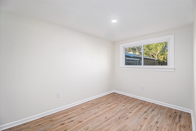 unfurnished room featuring light hardwood / wood-style floors