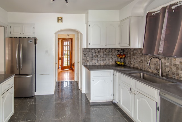 kitchen with sink, white cabinetry, and stainless steel appliances