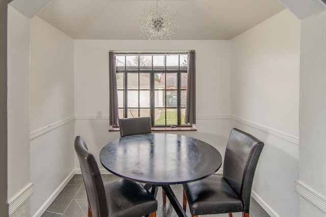 dining space featuring an inviting chandelier