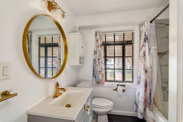 full bathroom featuring tile patterned floors, vanity, shower / bath combination with curtain, and toilet