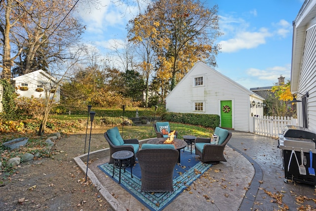 view of patio featuring grilling area and an outdoor fire pit