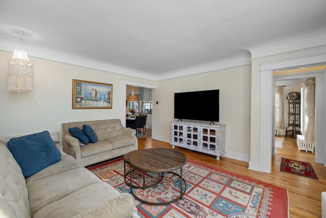 living room with plenty of natural light and wood-type flooring