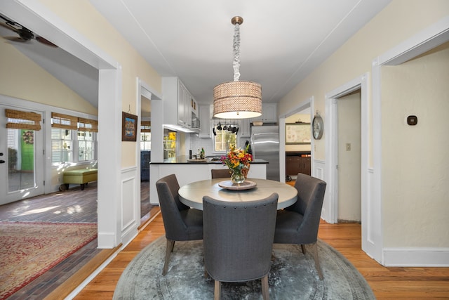 dining space with ceiling fan and light hardwood / wood-style floors