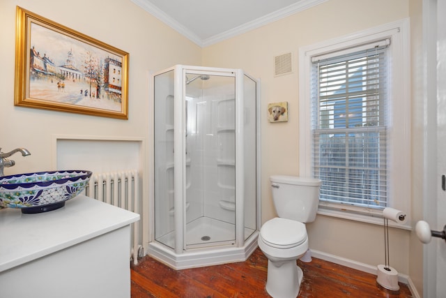 bathroom with walk in shower, hardwood / wood-style floors, and radiator