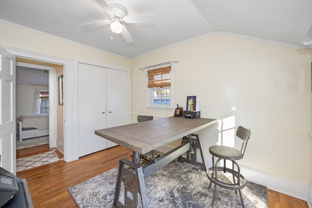 office area featuring ceiling fan, dark wood-type flooring, vaulted ceiling, and ornamental molding