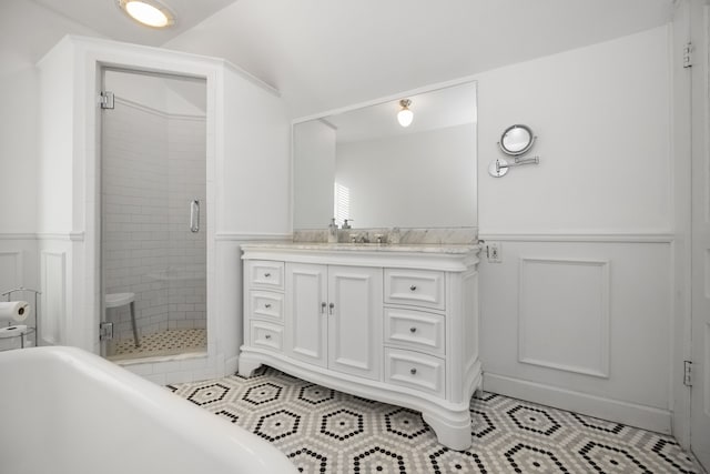 bathroom featuring tile patterned flooring, vanity, an enclosed shower, and lofted ceiling