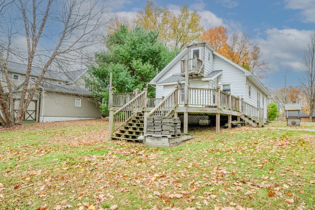 back of house with a yard and a wooden deck