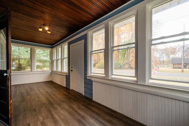 unfurnished sunroom featuring wooden ceiling