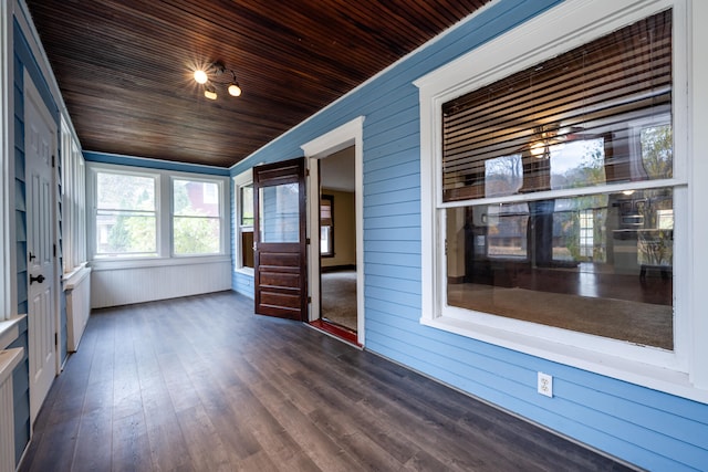 unfurnished sunroom featuring wooden ceiling