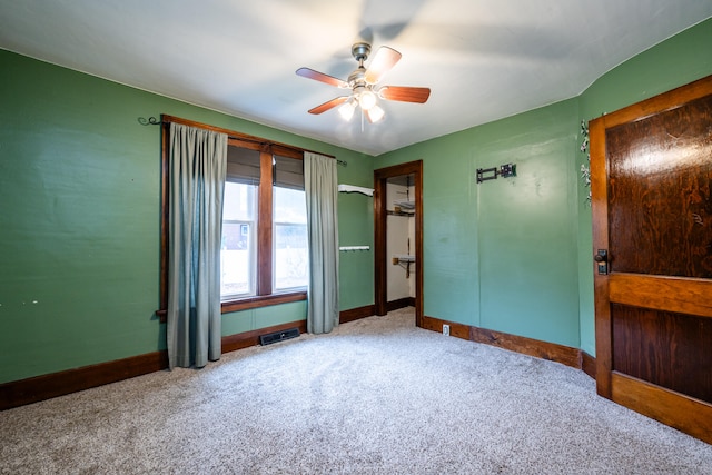 unfurnished bedroom featuring ceiling fan and carpet floors