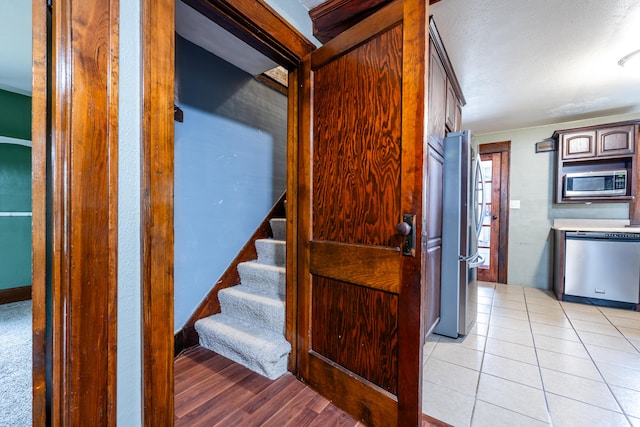 stairs with tile patterned flooring