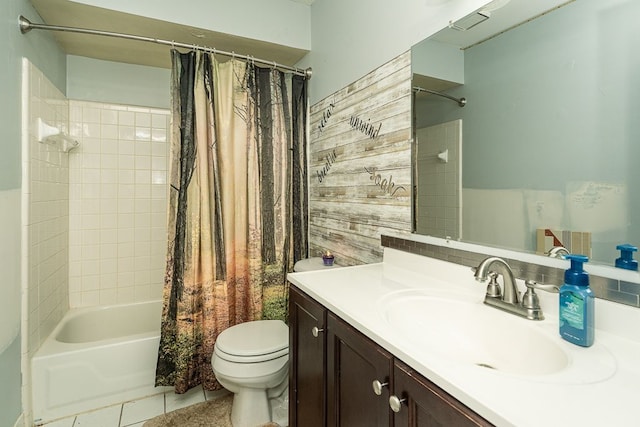 full bathroom featuring shower / tub combo, toilet, tile patterned floors, vanity, and wooden walls