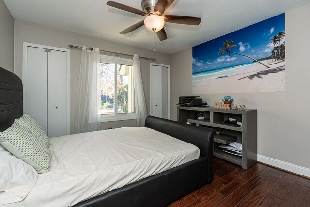 bedroom with ceiling fan and dark wood-type flooring