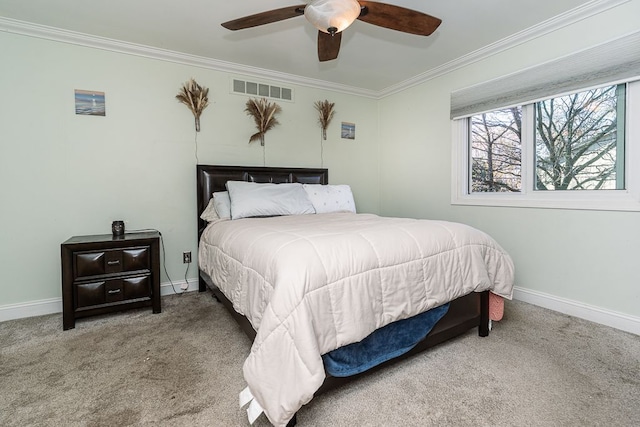 bedroom featuring ceiling fan, carpet, and ornamental molding