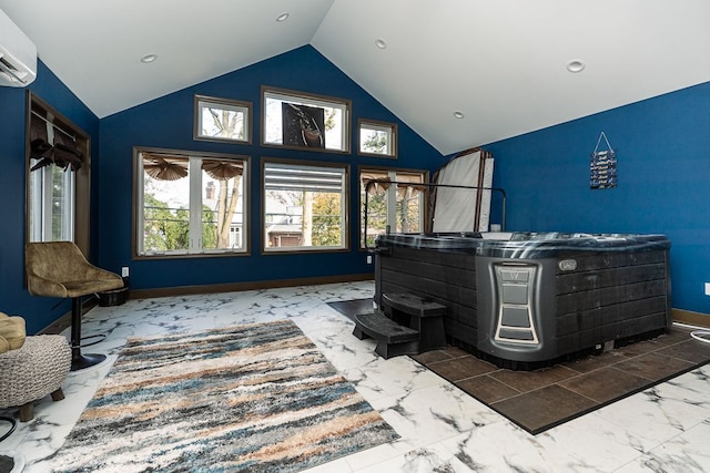 interior space featuring a wall unit AC and high vaulted ceiling