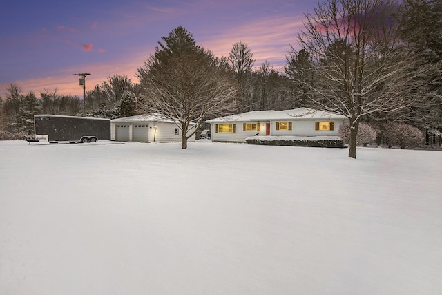 exterior space featuring a garage and an outbuilding