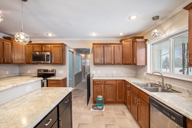 kitchen featuring crown molding, sink, hanging light fixtures, and appliances with stainless steel finishes