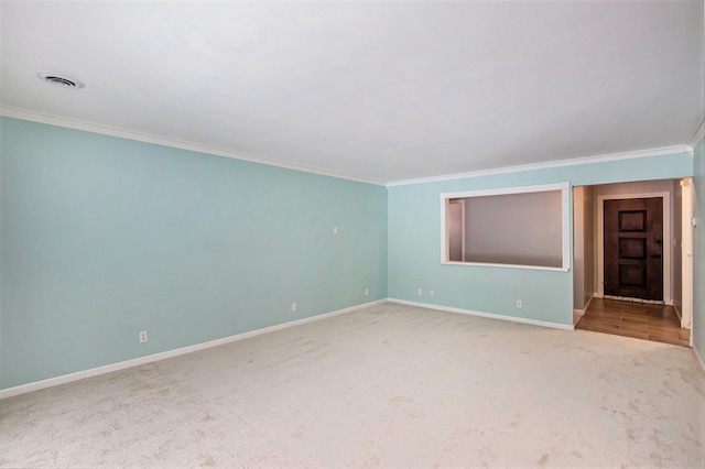 unfurnished room with carpet floors and ornamental molding