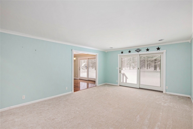 empty room with carpet flooring and ornamental molding