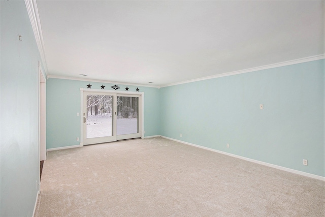 spare room with light carpet and ornamental molding