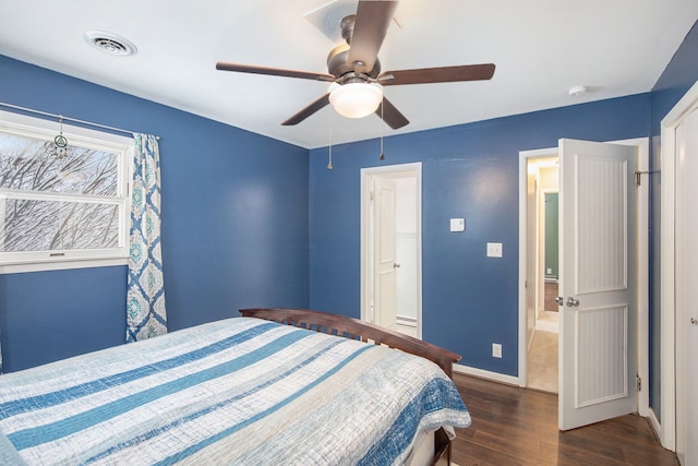 bedroom featuring dark hardwood / wood-style floors and ceiling fan