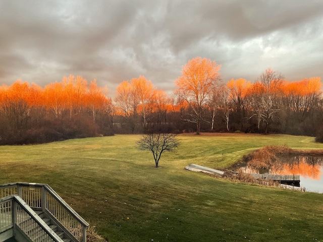 yard at dusk with a water view