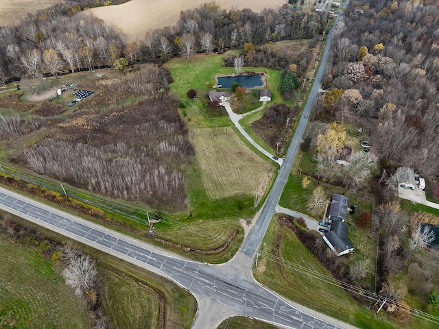 birds eye view of property with a rural view