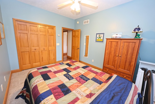 bedroom featuring light carpet, a closet, and ceiling fan