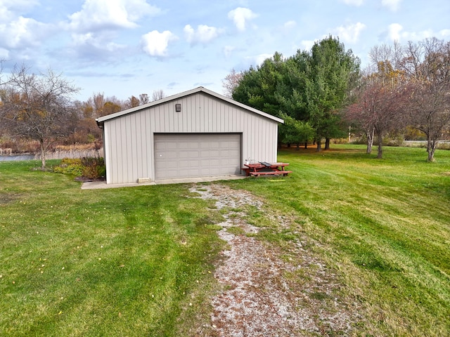 garage featuring a lawn