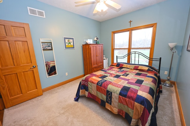 carpeted bedroom featuring ceiling fan