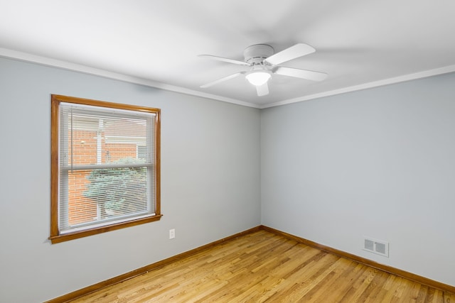 unfurnished room with ceiling fan, light hardwood / wood-style floors, and ornamental molding