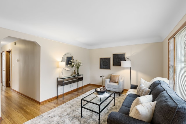 living room with light hardwood / wood-style flooring