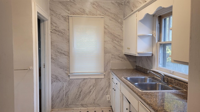 931 Hughes Ave, Flint, MI 48503 - kitchen featuring a sink, plenty of natural light, and white cabinets