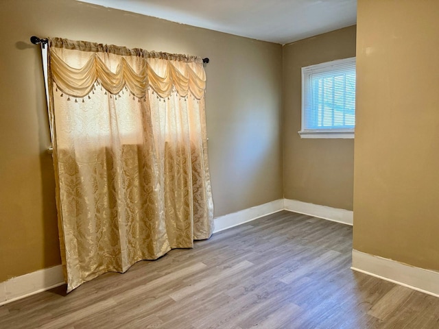 931 Hughes Ave, Flint, MI 48503 - empty room featuring wood finished floors and baseboards