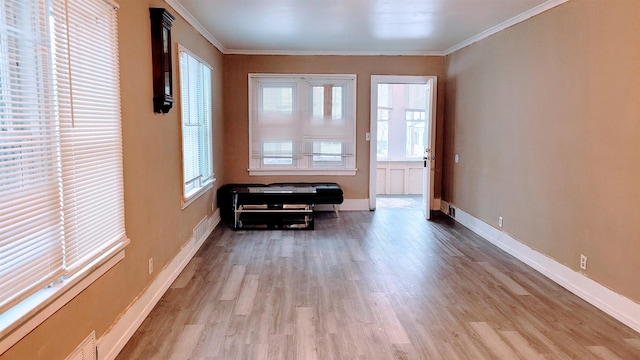 931 Hughes Ave, Flint, MI 48503 - foyer entrance with ornamental molding, wood finished floors, and baseboards