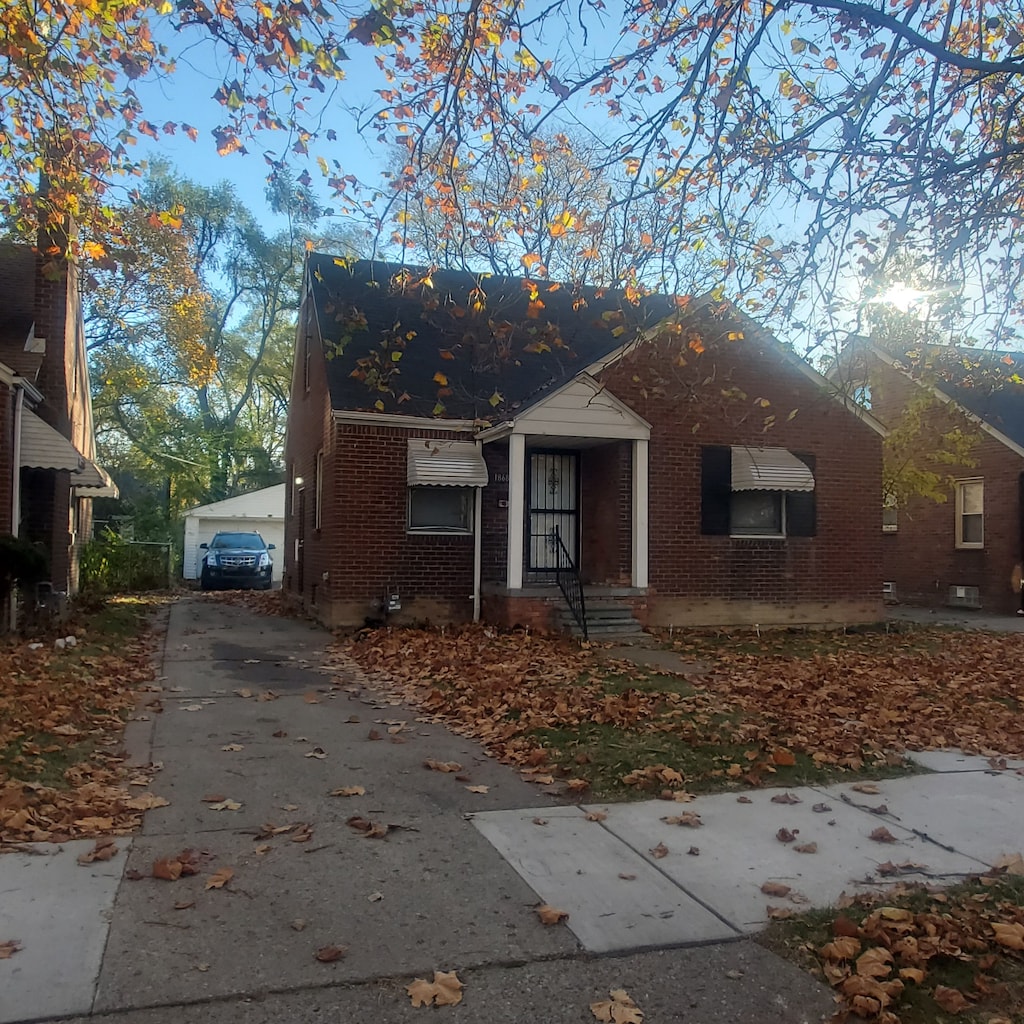 view of front of house featuring an outbuilding and a garage