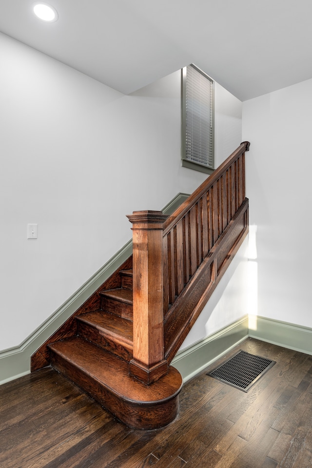 stairs with wood-type flooring