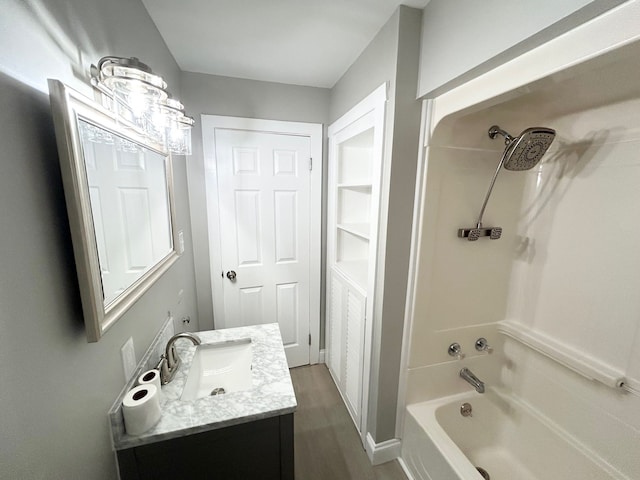 bathroom with vanity and bathing tub / shower combination