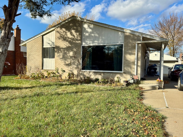 view of side of property with a yard