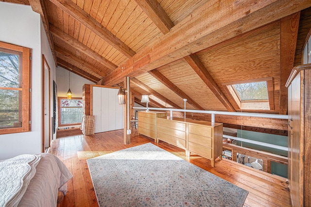 bonus room with wooden ceiling, light hardwood / wood-style floors, and lofted ceiling with skylight