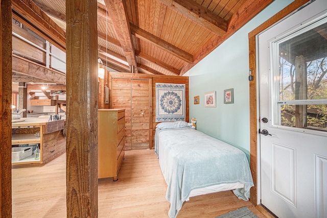 bedroom with vaulted ceiling with beams, wooden ceiling, and light hardwood / wood-style floors